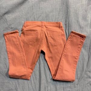 Peach colored skinny jeggings
